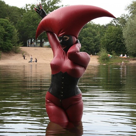 Lady Avengelique In A Red Latex Alien Costume Poses In A Lake