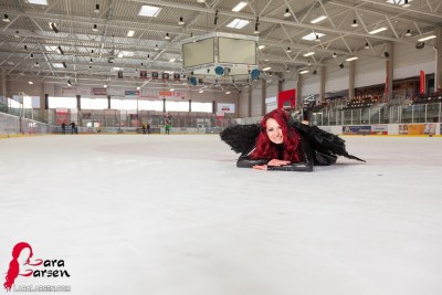Lara Larsen In Black Swan On Ice 8