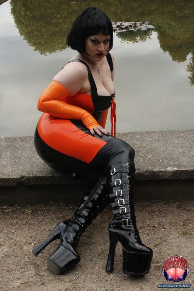 Public Posing In Orange Black Latex Outfit 7