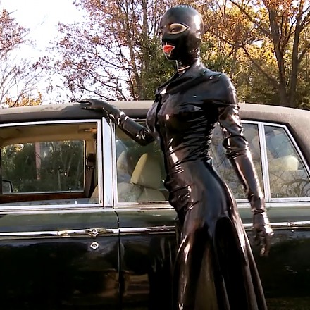 Latex Lucy Poses Around Her Fancy Car And Plays With Red Dildo