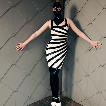 Dutch Dame In A Zebra Latex Dress And Rubber Hood Is Caught And Restrained