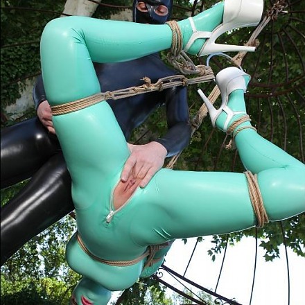 Another Day In The Kinky World Of Latex Lucy Suspended By Ropes In The Garden Terrace