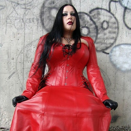 Dark Haired Fetish Lady Angelina Poses Outdoors In Red Leather With Black Gloves And High Heels