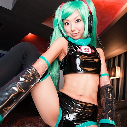 Green Haired Japanese Cosplay Girl Necosmo In A Black Pvc Outfit With Stockings And Gloves